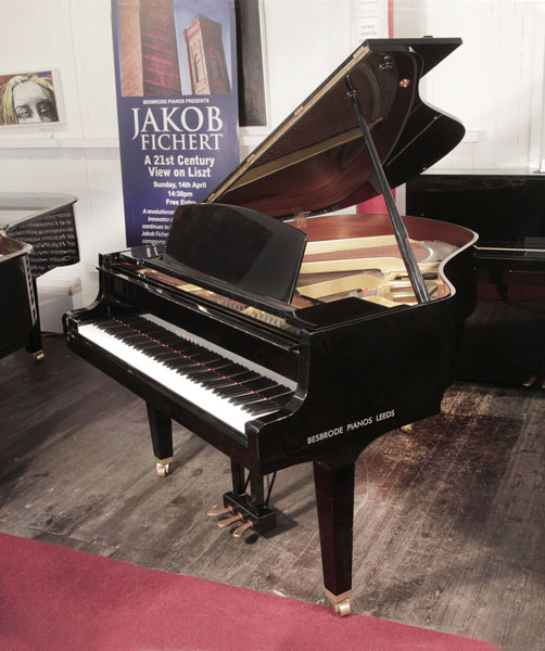 Reconditioned,  1988, Yamaha GH1 baby grand piano for sale with a black case and square, tapered legs.  Piano has an eighty-eight note keyboard and a three-pedal lyre.   