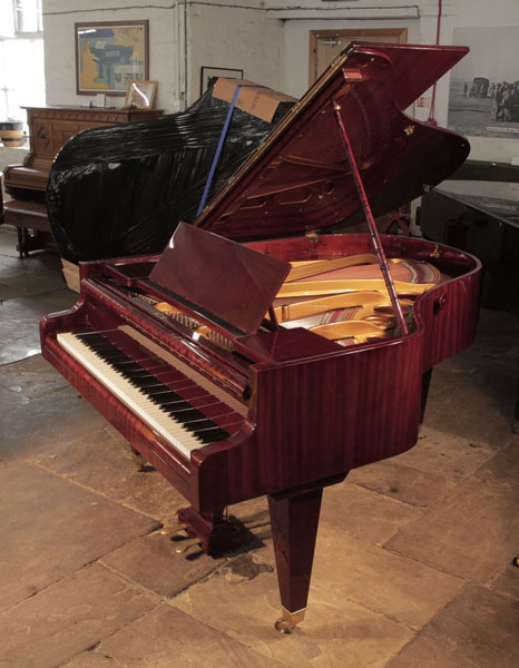 Restored, 1930's Bosendorfer grand piano for sale with a mahogany case and square, tapered legs. Piano has an eighty-eight note keyboard and a two-pedal lyre.