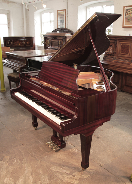 Reconditioned,  1986, Kawai KG-1D baby grand piano with a mahogany case and spade legs. 