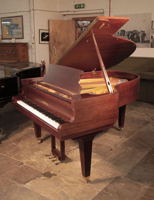 Reconditioned,  1987,  Schimmel grand piano for sale with a mahogany case and square, tapered legs. Piano has an eighty-eight note keyboard and a two-pedal lyre. 