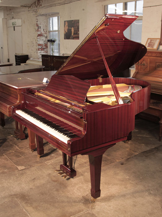 Reconditioned, 1987, Yamaha C3 grand piano for sale with a mahogany case and spade legs. Piano has an eighty-eight note keyboard and a three-pedal lyre. 